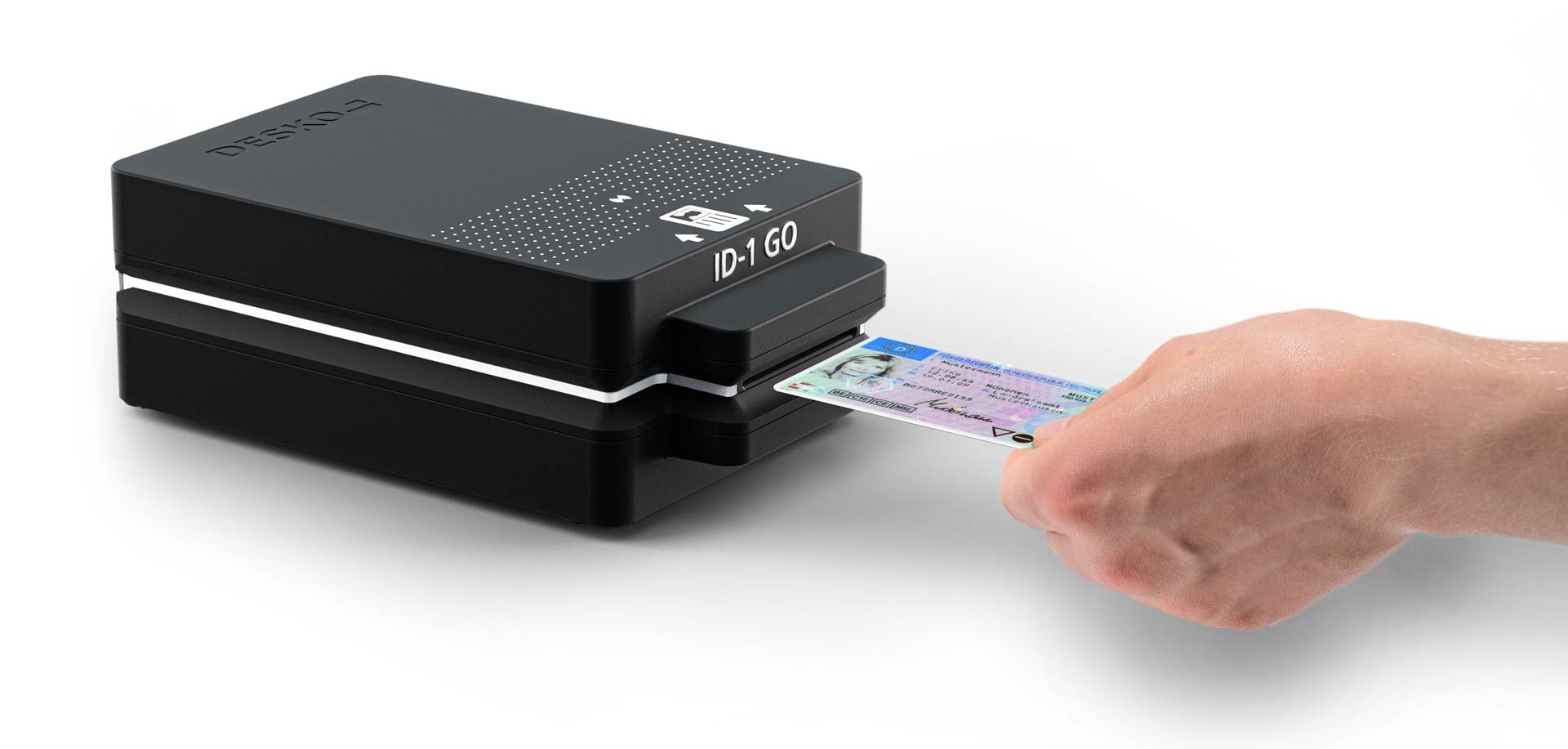 Hand inserts a driving licence into a compact DESKO ID-1 GO reader.
