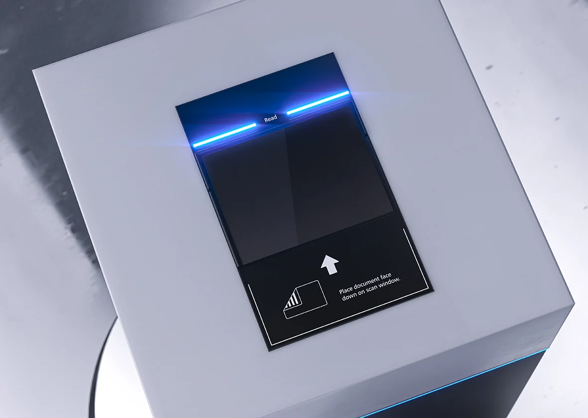 Vue d&eacute;taill&eacute;e d'une surface de num&eacute;risation avec une barre de LED bleues, une fen&ecirc;tre en verre et un graphique d'indication pour la mise en place d'un document.