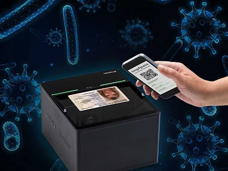ID card scanner reads ID card, next to smartphone with digital vaccination certificate in front of symbolic virus graphics.