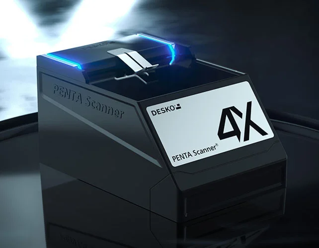 DESKO PENTA Scanner 4X with blue LED light, modern document scanner device in a dark studio environment.