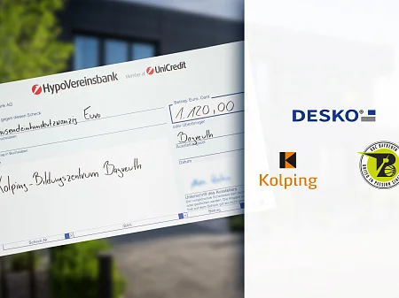 Symbolischer Scheck der HypoVereinsbank über 1.120 Euro für das Kolping-Bildungszentrum Bayreuth, daneben DESKO- und Partnerlogos.